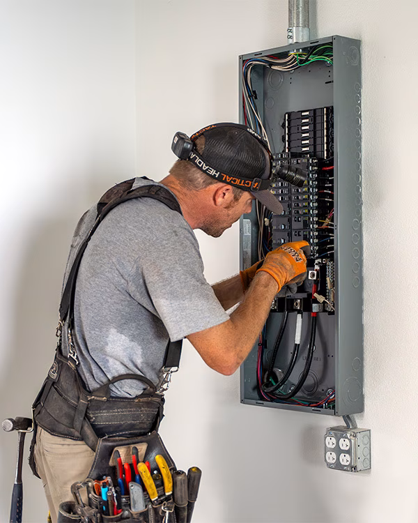 G5 Electrician working on a commercial electrical panel in Evansville, Indiana.